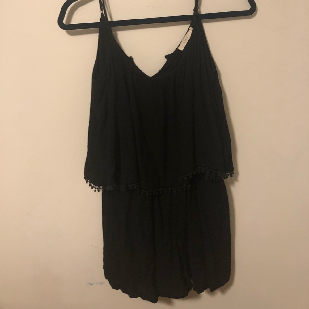 Black flounce top romper